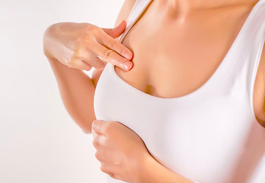 How is a breast mass detected?